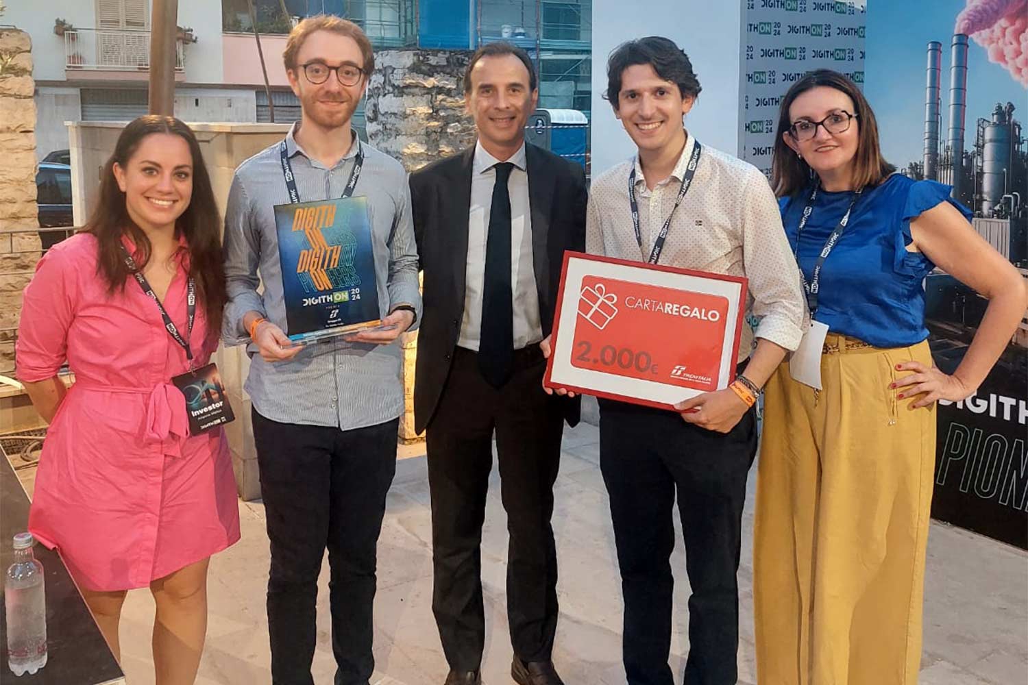 Our founders celebrate with Gruppo FS representatives after receiving the prestigious Innovation Award at DigithON 2024.