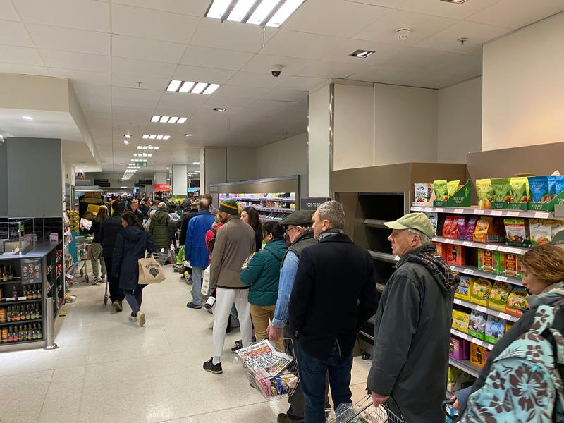 People queuing in a supermarket