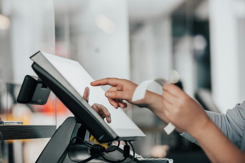 A person using a POS system